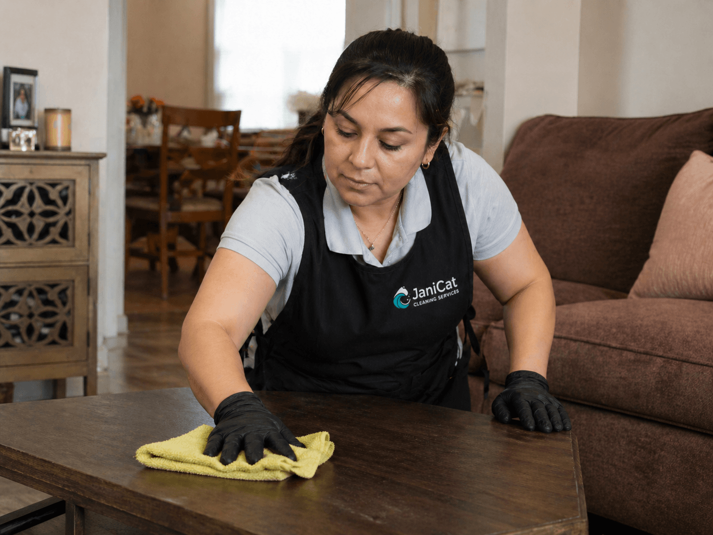 Janicat team member preparing an Airbnb living room